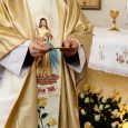 priest-holding-golden-plate-for-communion-at-wedding-ceremony-at-church.jpg